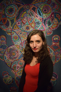 Artist Evi Falci with her work